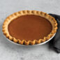 Baked pumpkin pie in Naturals® High Dome Covered Pie Pan