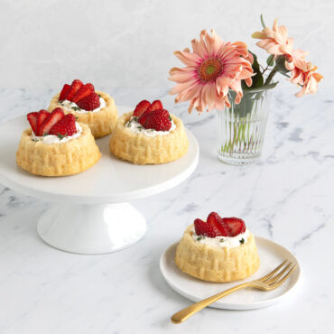 Shortcake Basket Cakes with whipped cream and strawberry slices