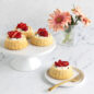 Shortcake Basket Cakes with whipped cream and strawberry slices
