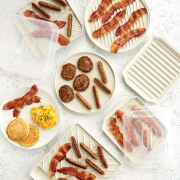 Overhead bacon trays group shot with sausage, eggs and bacon