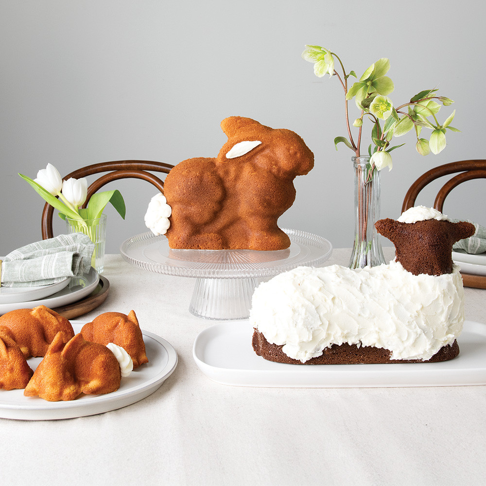 Image of baked ornament cakelets on a cooling rack with pan on surface