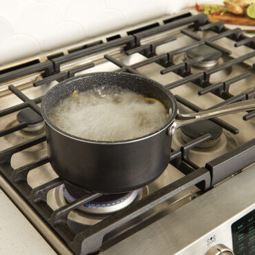 3 Qt Sauce Pan on stove top, boiling pasta