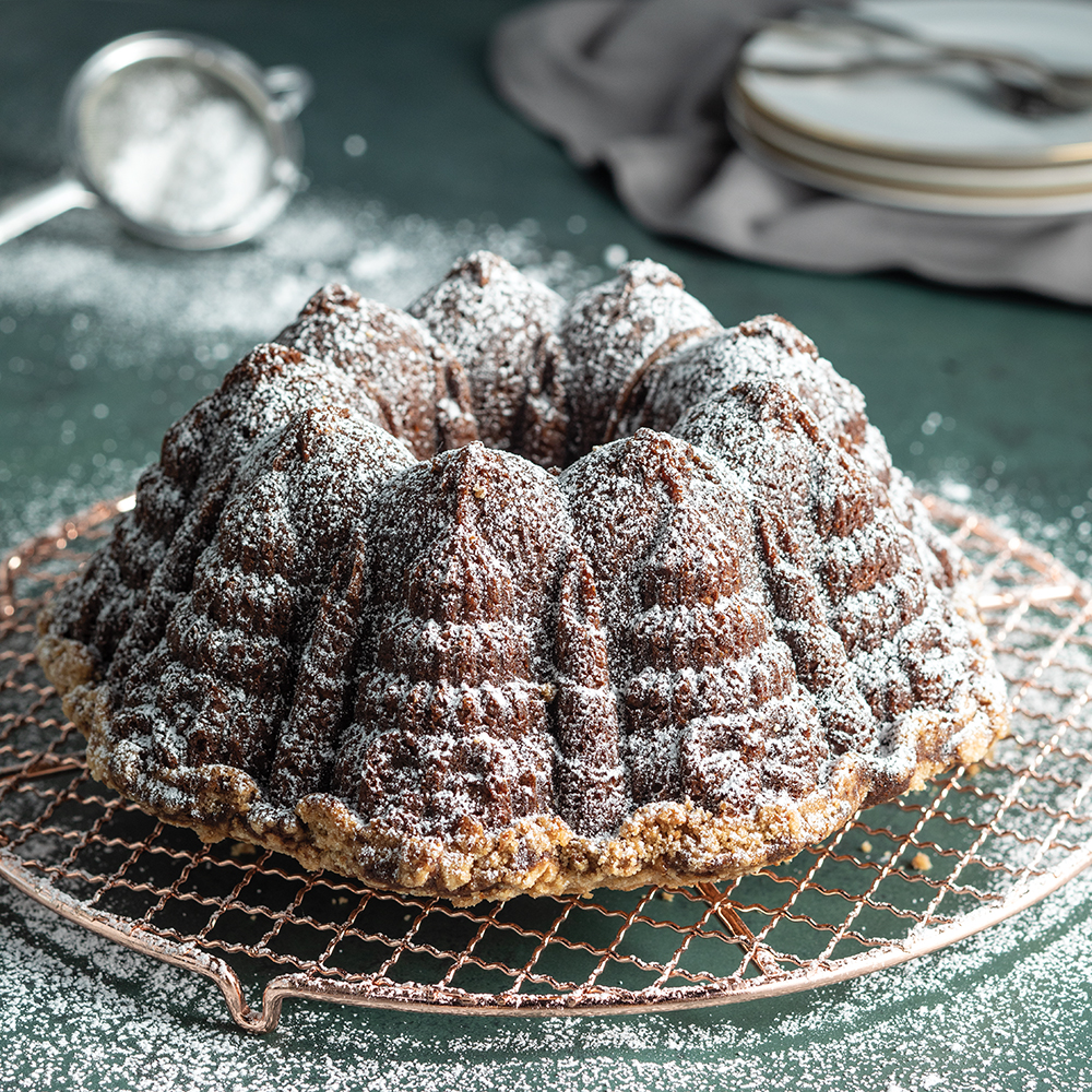 https://www.nordicware.com/wp-content/uploads/2023/08/Gingerbread-Streusal-Bundt-Cake_Very-Merry-Bundt_BOTM_1K.jpg