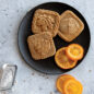 Fall Forest Springerle Stamped Cookies on black plate with orange slices