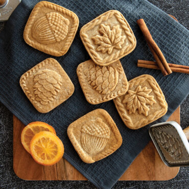 Fall Forest Springerle Stamped Cookies on wooden board with stamps on surface