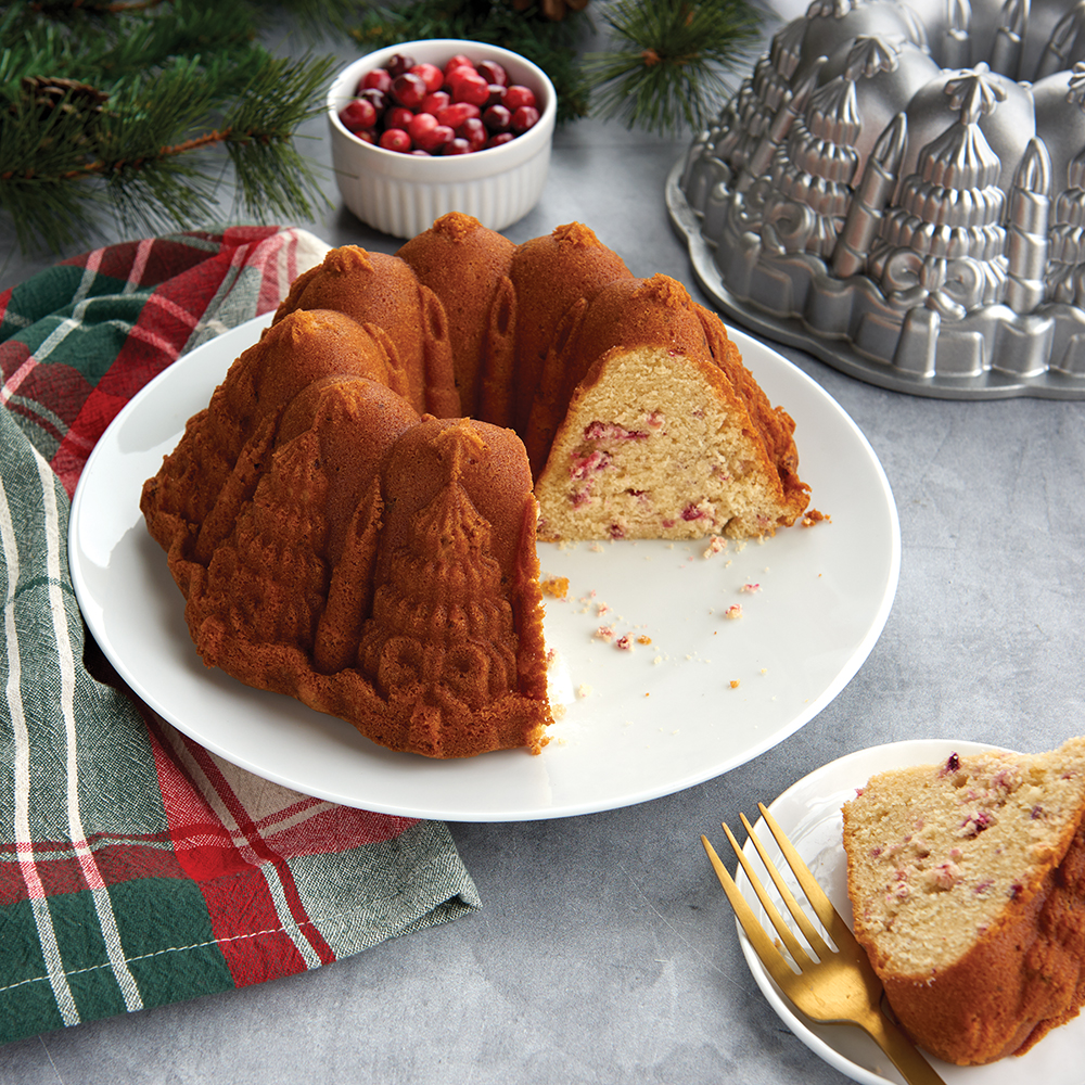 Image of baked cranberry white chocolate very merry Bundt Cake in holiday scene