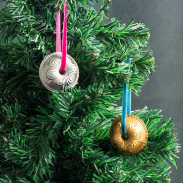 Chiffon Bundt silver and gold ornaments hanging on tree