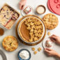 Group pie scene with Pumpkin pie, two mini apple pies and pie bars with hands grabbing slices