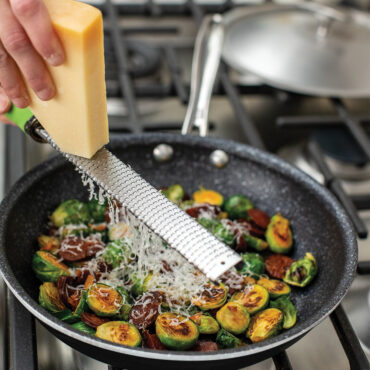 Basalt 2 Piece 10" Skillet with Lid, Brussel sprouts with cheese being shredded