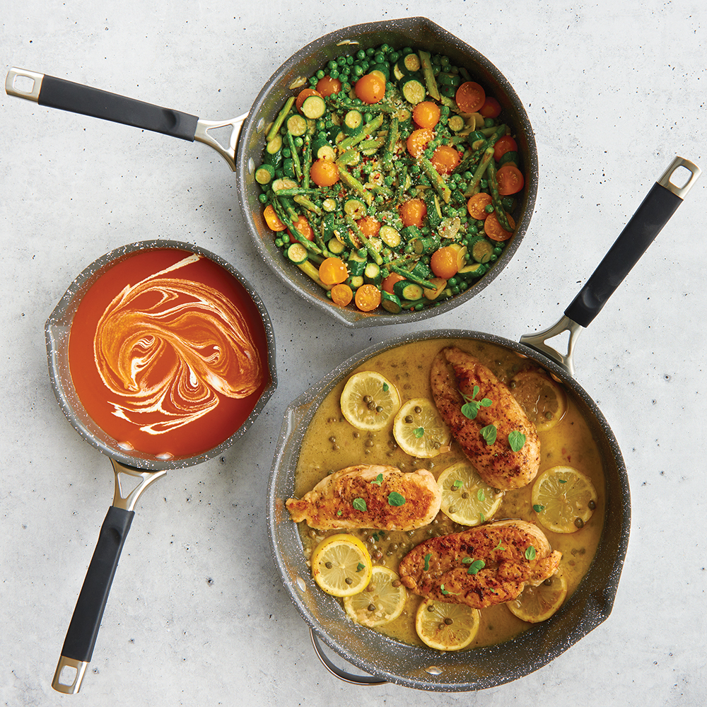 Image of best-selling Verde Ceramic 3 Piece Skillet Set, overhead of all 3 with cooked food