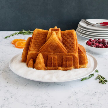 Gingerbread House Bundt® cake sitting on plate, plain.