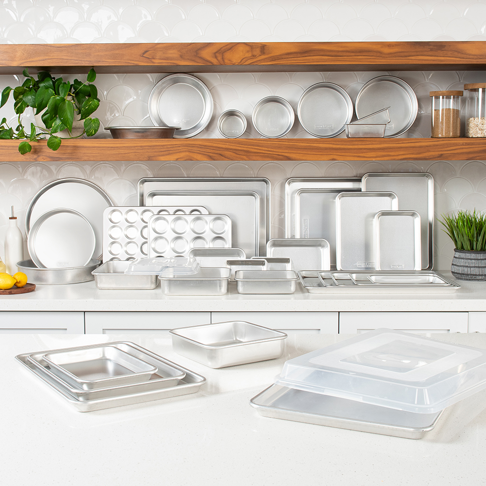 Image of kitchen shelves filled with Nordic Ware Naturals Bakeware: sheet pans, cake pans and more! Shop now